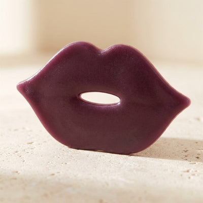 Close-up of a single Verra Lumo lip-shaped hydrogel patch